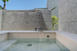 a water fountain in the middle of a building at 제주살랑 in Tŏksu-dong