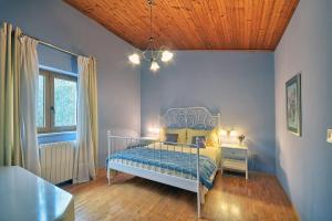 a bedroom with a bed and a wooden ceiling at Bamboo Garden Oasis with Pool in Pula +26 photos