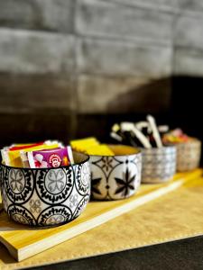 a counter with three bowls of food on a shelf at Rosetta - Ai Meli - Dolomites in Lozzo Cadore