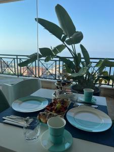 a table with plates of food on top of a balcony at Guest House Seataly - by Be Your Home in Civitavecchia