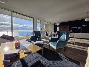 a living room with a view of the ocean at Guest House Seataly - by Be Your Home in Civitavecchia