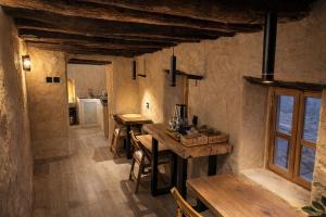 a kitchen and dining room with a table and chairs at بيت العريش Arish house in Sayq