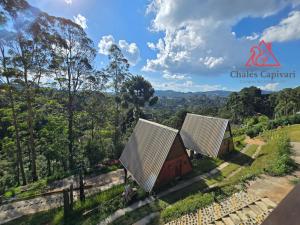an image of a farm with two barns at Chale Capivari Estrela in Campos do Jordão