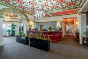 a lobby with a coffered ceiling and a salon at The Savoy Hotel in Blackpool