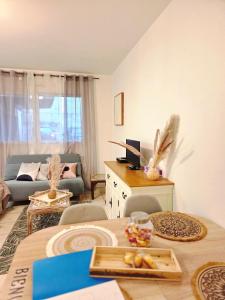 a living room with a table and a couch at FELTON - Appartement 2 pers Dinan in Dinan