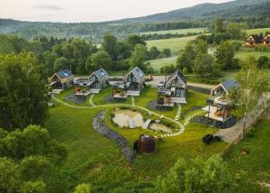 an aerial view of a home with a yard at Krzywe Pearl Chalets in Krywe