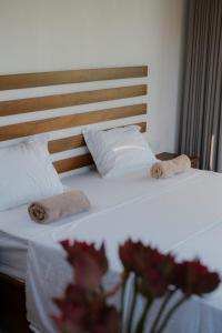 a bedroom with two beds with towels on them at Django Villa Weligama in Weligama