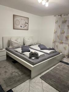 a bedroom with a large bed in a room at Ferienwohnung „ Zum Josefstal „ in Sankt Ingbert
