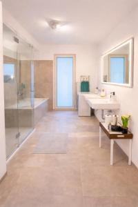 a bathroom with two sinks and a shower at Danube Tower holiday in Vienna +56 photos