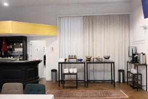 a living room with a table with glasses on it at Sonne Hotel in Herne