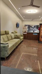a living room with a couch in a room at Hotel Sun Suites - A unit of SUN Group - Spacious Rooms - Brand New Building in Tirupati