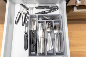 a drawer filled with utensils in a refrigerator at Danube Tower holiday in Vienna