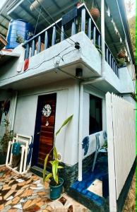 a house with a staircase on top of it at Kasa Gigi in El Nido +8 photos