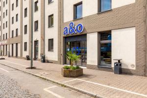 a building with a sign on the side of a street at a&o Frankfurt Ostend in Frankfurt