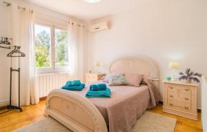 a bedroom with a bed with two towels on it at Sa Caseta De Portocolom in Felanitx +33 photos