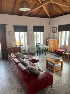 a living room with a couch and a table at Casa Laryssiou in Gythio