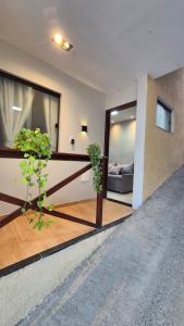 a living room with a balcony with two plants at Apt 18 - VR Village in São Luís