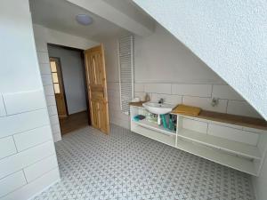 a white bathroom with a sink and a sink at Kafírna Ovesné Kladruby in Ovesné Kladruby