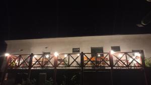 a building with lights on a balcony at night at Kafírna Ovesné Kladruby in Ovesné Kladruby