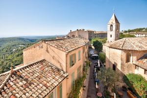 an aerial view of a town with buildings and a church at Apt le Nid in Tourrettes-sur-Loup