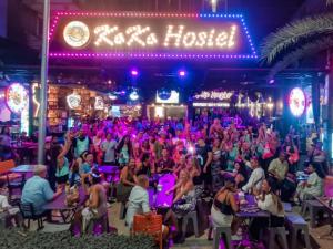 a crowd of people sitting in front of a nightclub at KOKO Party Hostel 18-40 in Ao Nang Beach
