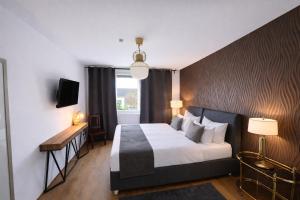 a hotel room with a bed and a window at Pension Stadt Mannheim in Mannheim