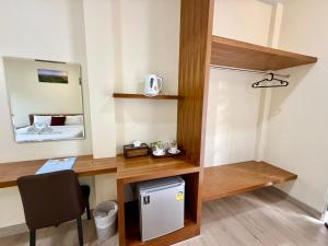 a room with a desk and a mirror at Farinda Resort in Phangnga +64 photos