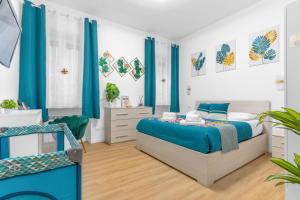 a bedroom with a blue bed and blue curtains at Naviglio Pop House zona Humanitas-Forum con wifi in Rozzano