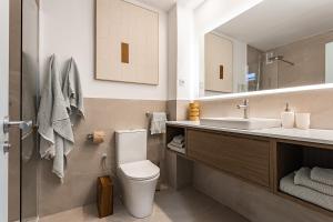 a bathroom with a toilet and a sink at Comfortable and spacious flat in Barcelona in Barcelona +31 photos