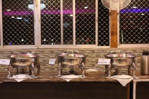 a group of drums on a counter in a restaurant at ANAND LOK VATIKA in Rājgīr