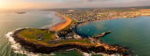 an aerial view of a beach and the ocean at The Captains Wheel and Anchor in Skerries