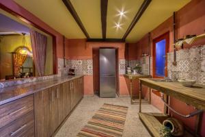 a kitchen with a sink and a refrigerator at Fatma Hanoum Old Town in Rhodes Town