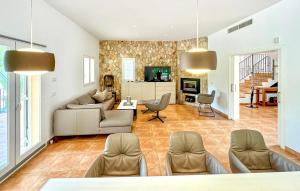 a living room with a couch and a table at Villa Rondo in Costa de la Calma
