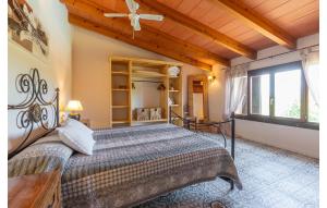 a bedroom with a bed with a wooden ceiling at Es Sequer in Felanitx
