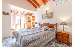 a bedroom with a large bed and a window at Es Sequer in Felanitx +40 photos