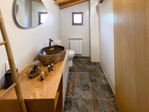 a bathroom with a sink and a toilet at Casas da Assureira in Castro Laboreiro +138 photos