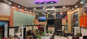 a room with a large screen in the middle at ANAND LOK VARANASI in Varanasi
