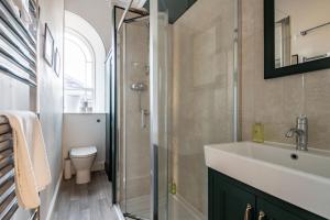 a bathroom with a sink and a shower at Upper Rocklands - Elie in Earlsferry +25 photos