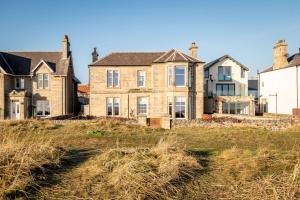 an old house on a grassy hill at Upper Rocklands - Elie in Earlsferry