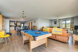 a living room with a ping pong table in it at 3 Bed in Coelbren oc-way238 in Coelbren