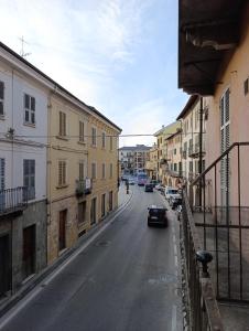 a car driving down a city street with buildings at Da Lucia in Dronero