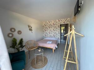 a small room with a bed and a ladder at La Buissonnière Lodges in Chisseaux