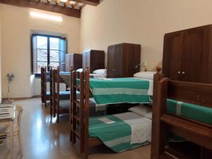 a group of bunk beds in a room at Ostello San Marco Cortona in Cortona