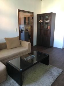 a living room with a couch and a coffee table at Gutshaus Breesen in Laage +6 photos
