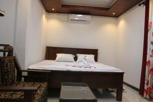 a room with a bed and a chair in it at Wadula Resort in Nochchiyagama +16 photos