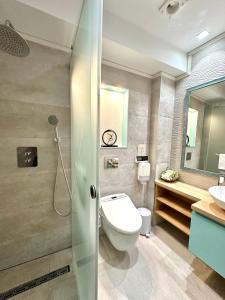 a bathroom with a toilet and a sink at House4You - Blanari in Bucharest +43 photos