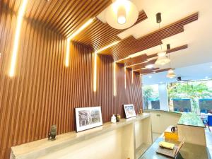a lobby with a wood paneled wall at SkyVilla BKK - Pool & Chill - Laundry included in Phnom Penh +131 photos