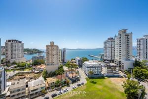 an aerial view of a city with tall buildings at Modern Condominium w/ Sea View Pool, Itapema - MHFB in Itapema