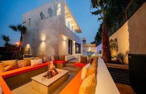 a living room with a couch and a fire place at Villa Horizon in Marrakesh