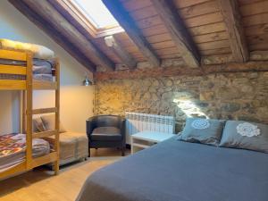 a bedroom with a bunk bed and a desk at Cal 1777 in Bourg-Madame